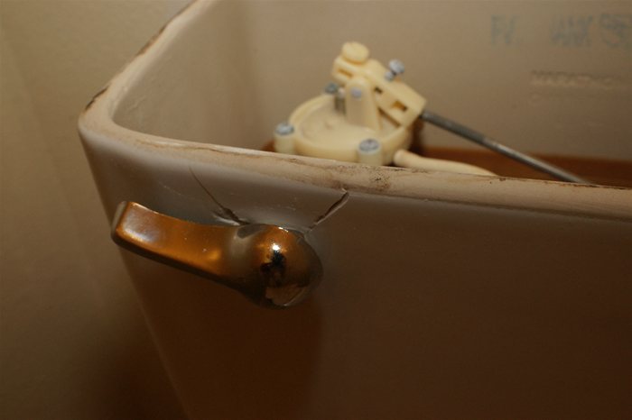 Porcelain Tank cracked by flush handle